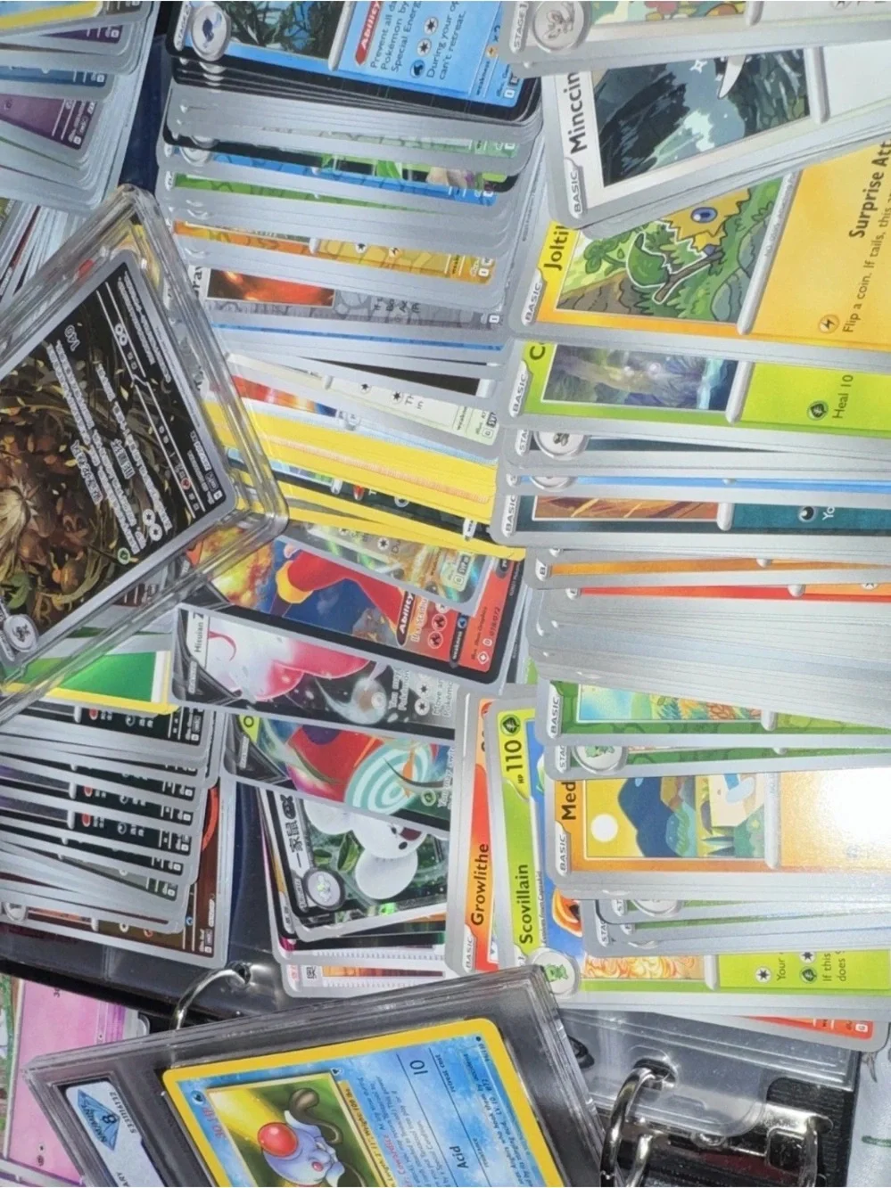 3 slabs and 500 bulk Assorted Pokemon including holo/ex. white flare black bolt